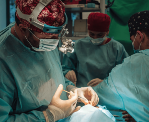 A patient in an operating room getting ready to receive treatment